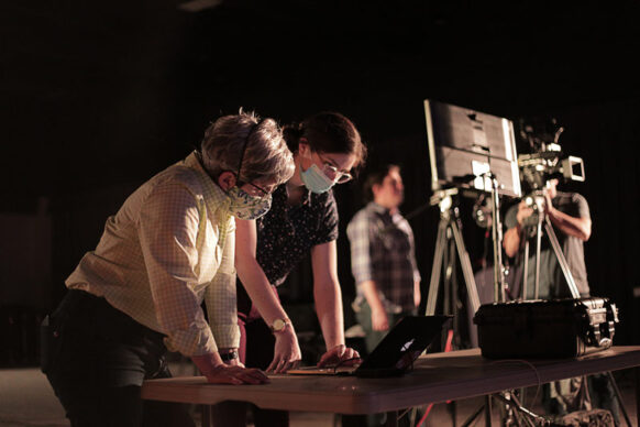 Emily Morris and Paula Gardner of Kino Mountain Productions looking at video footage on a laptop.