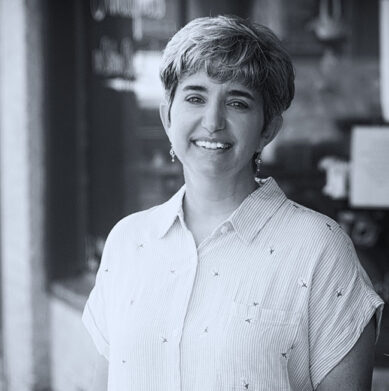 Paula Gardner of Kino Mountain Productions smiling on the street in downtown Apex, North Carolia.